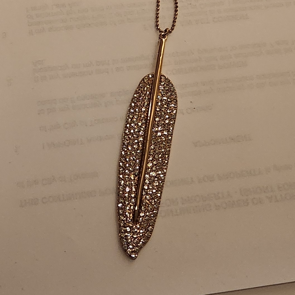 Gold-tone 32" long Sparkling Crystal Feather Leaf Pendant